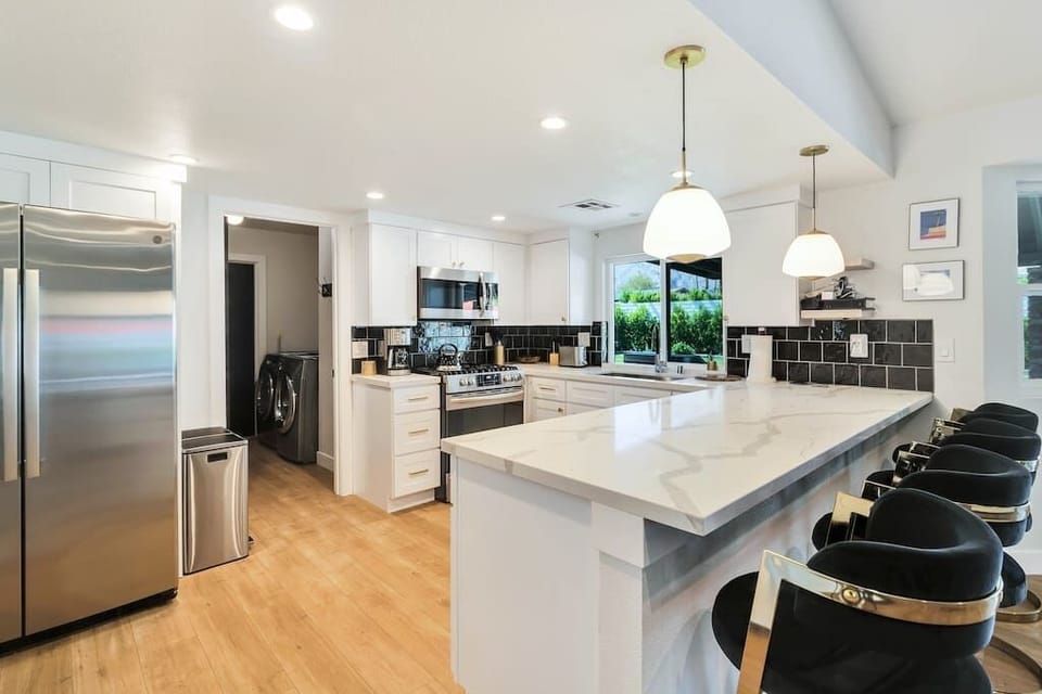 Large aesthetically pleasing kitchen with all of the space needed for great cooking. 