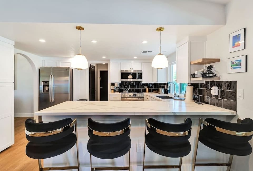 Chefs kitchen with all the amenities, stainless appliances and marble countertops.