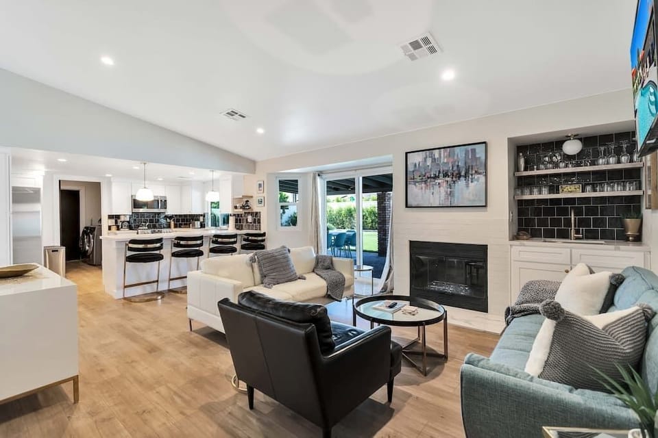 Cozy up to the fire or mix a drink at the wet bar in this spacious and modern living space. 