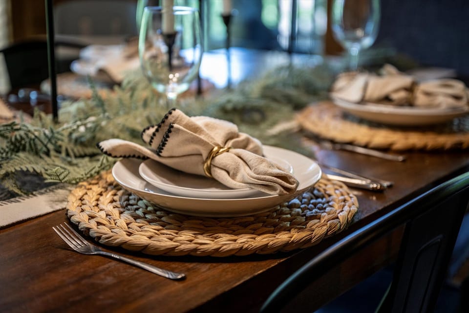 Set the table like you mean it — the forest watching your feast. Napkins and chargers not provided