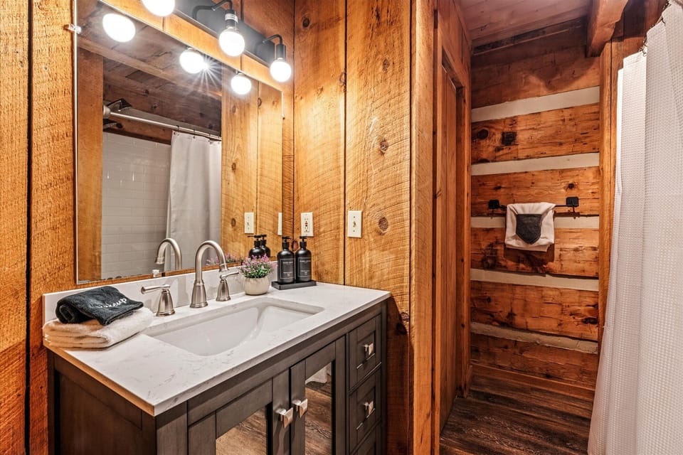 Brush your teeth in a bathroom that feels like a spa — warm wood, modern fixtures.