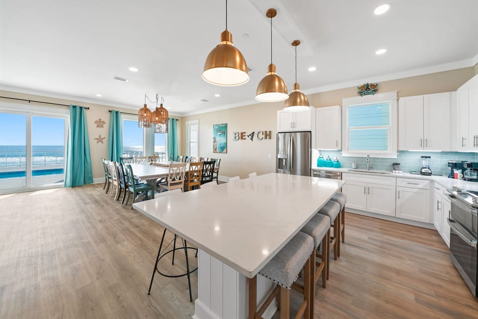 Your spacious kitchen opens to stunning ocean views, perfect for cooking with family while enjoying the sea breeze through large windows.
