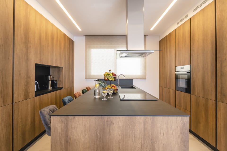 The rough-luxe kitchen is well-equipped for a self-catering stay.