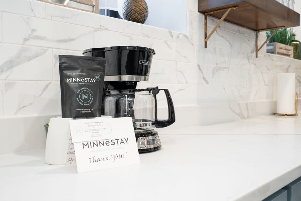 Wake up to freshly brewed coffee in your elegant kitchen, complete with premium amenities and a thoughtful welcome gift from your host.