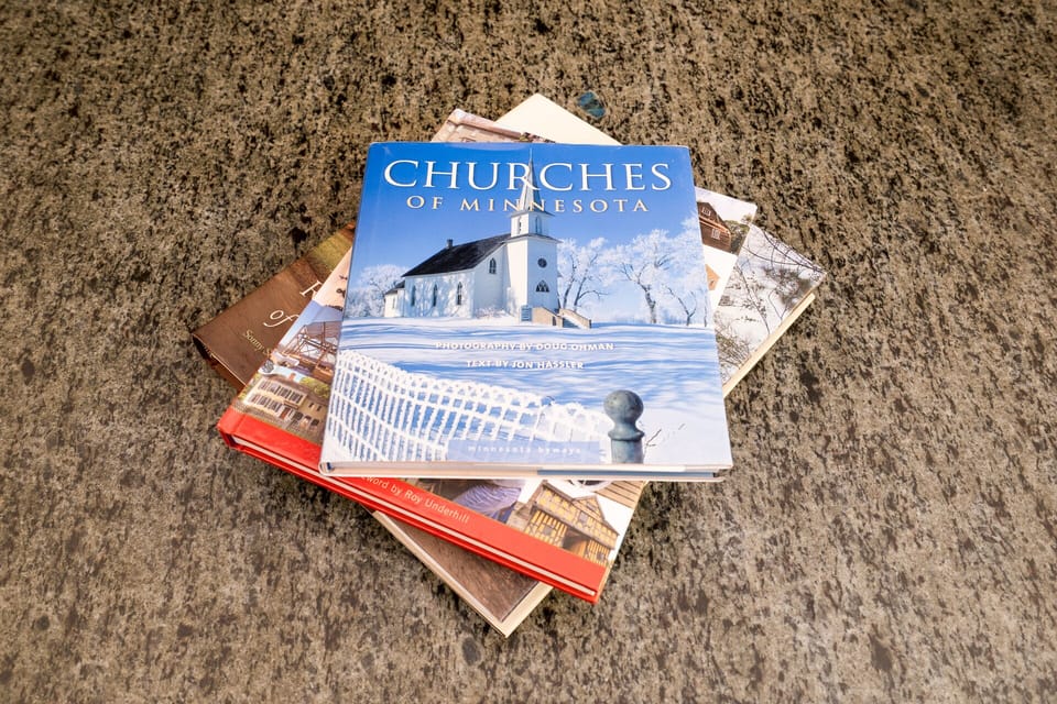 Browse local books and guides on your granite countertop, perfect for planning nearby adventures and discovering area attractions.