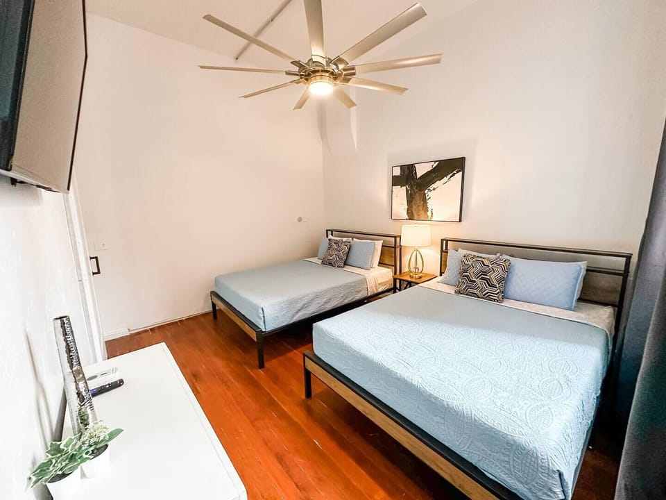 BEDROOM No. 1: Includes (2) Queen beds with all pillows, linens and blankets as well as a 50 inch ROKU Smart TV
