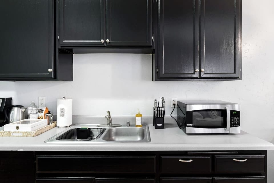 Full Kitchen includes all pots, pans, silverware, coffee maker, coffee, sugar, creamer, tea, blender, toaster, refrigerator, microwave, glasses, wine glasses and cooking/eating utensils