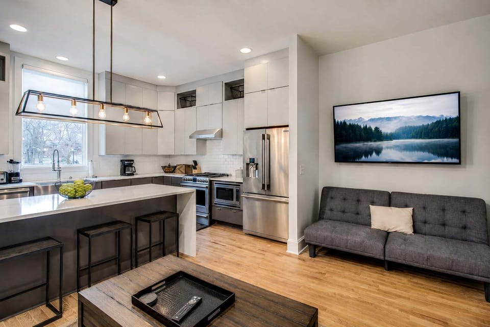 Open-concept kitchen and living area, perfect for cooking, gathering, and making memories together.