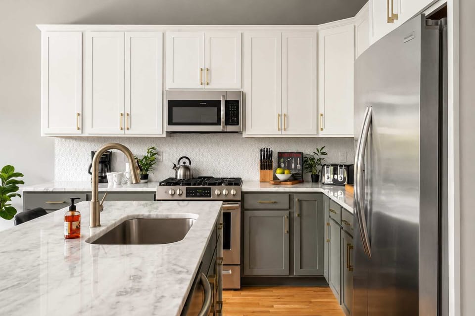Sleek modern kitchen with center island and full appliances