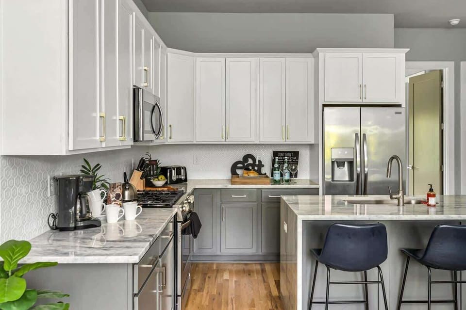 Contemporary kitchen with gray and white tones and spacious island
