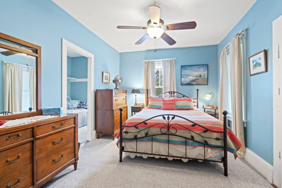 Upack and stay awhile with great dresser space and a Queen bed in this primary bedroom