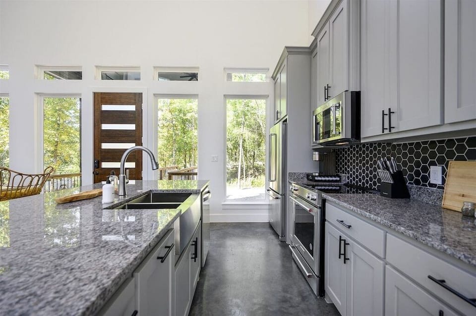 Gourmet Kitchen: Cook up a feast while enjoying views of nature through expansive windows!