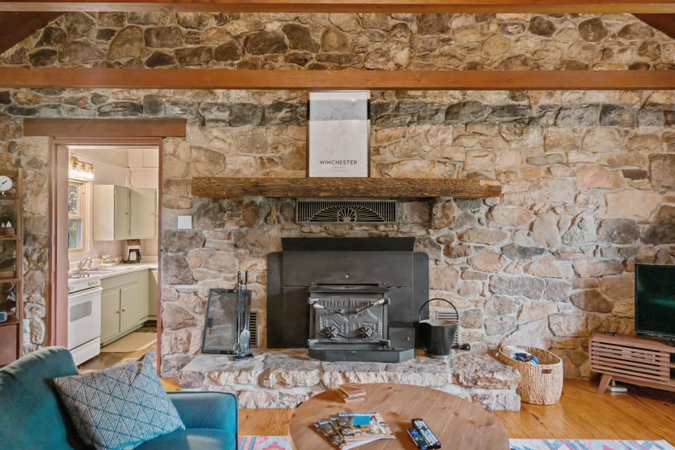 Expansive stone hearth is original to this 1960s cabin! 