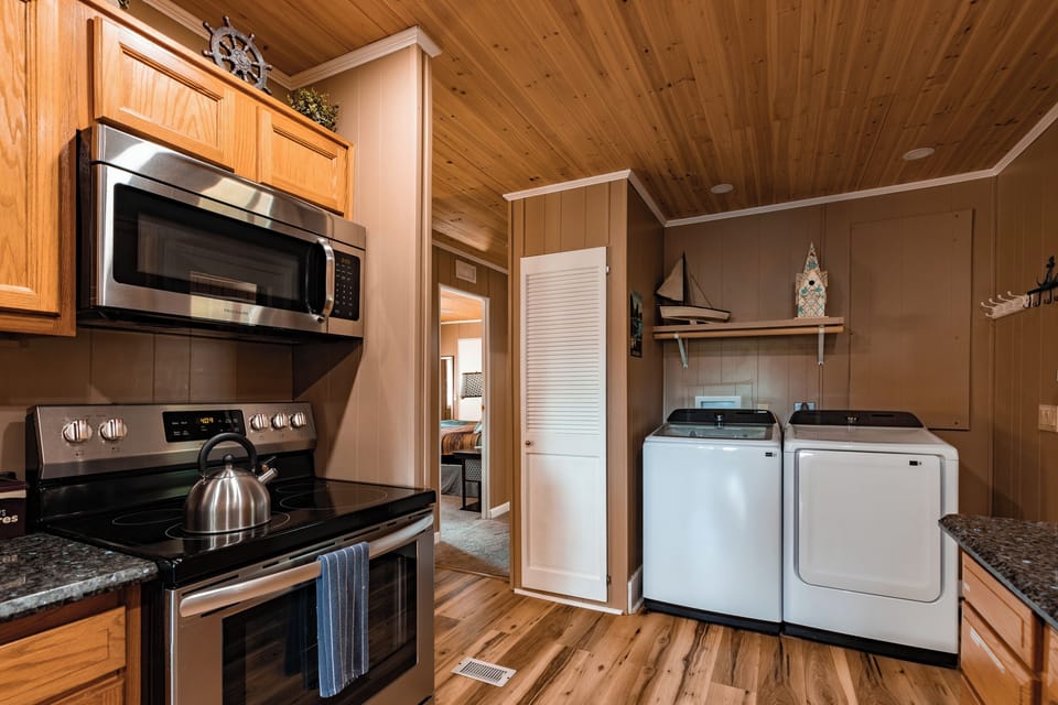 The kitchen includes full-size appliances, with a washer and dryer close by for longer family getaways.