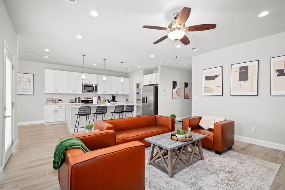 Unwind in the luxurious living room featuring a 75" Smart TV and fireplace! 