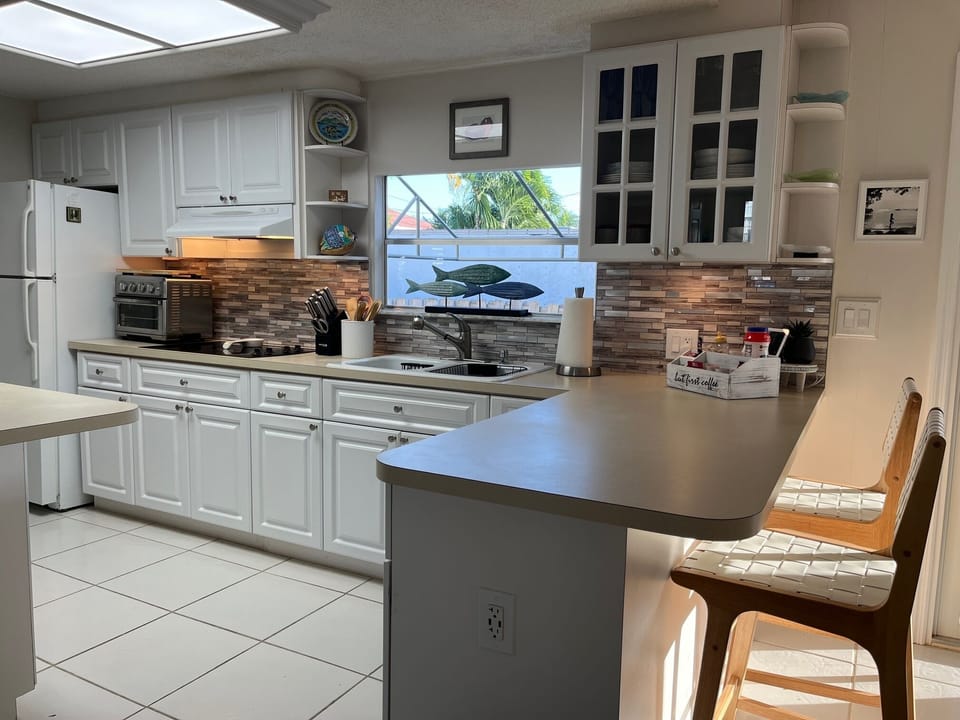 Updated Kitchen with Center Island and Eat-In Counter