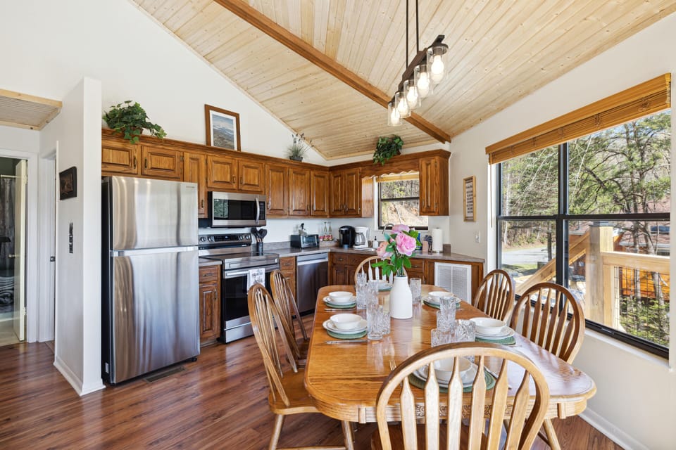 Full kitchen stocked with utensils, cookware, and coffee bar.