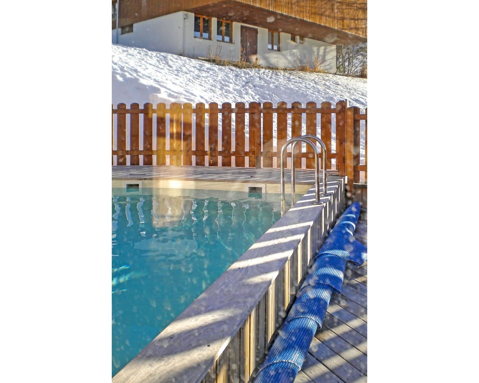 Water, Property, Building, Azure, Swimming Pool, Body Of Water, Leisure, Wood, Outdoor Furniture, Chair