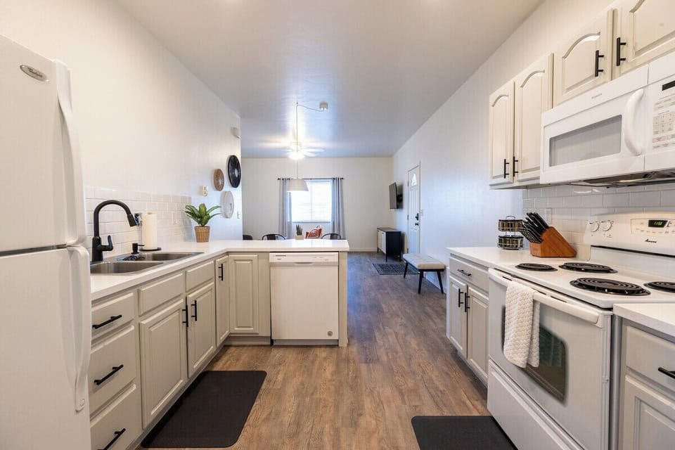 Cleaning up is easy with the efficient dishwasher and deep kitchen sink