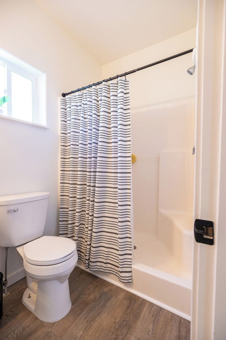 The master bedroom has a large shower with two seats