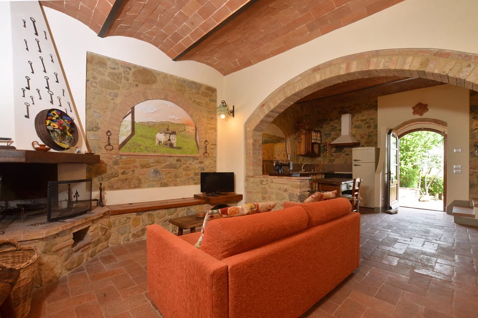 The living room with stone wall and fireplace
