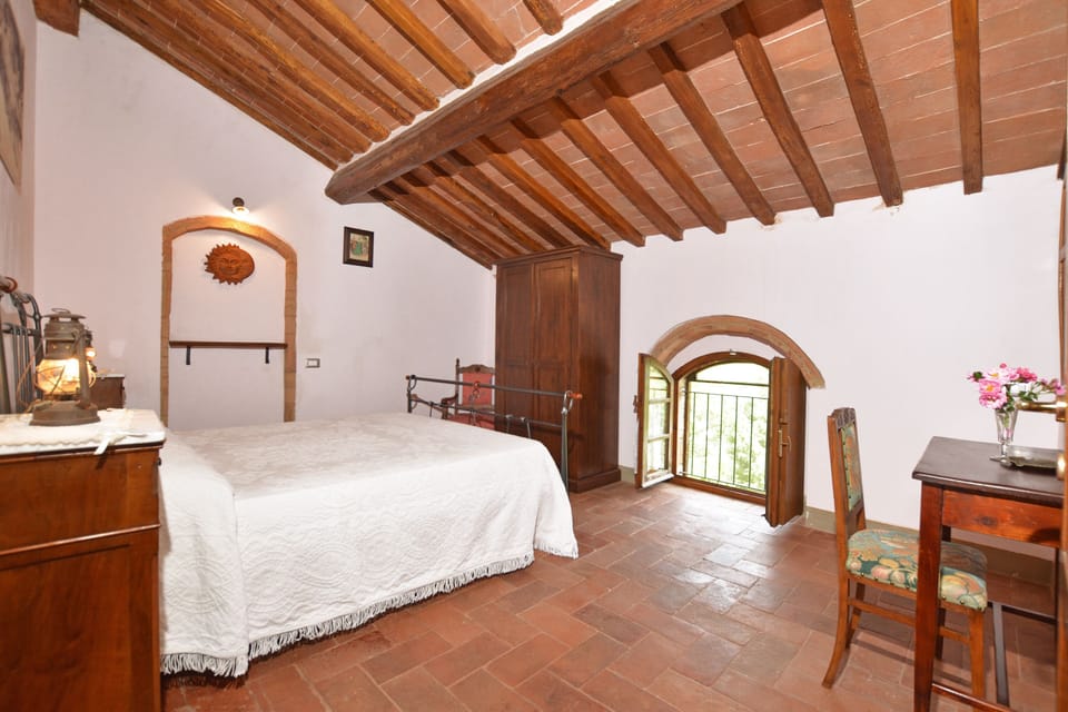 The upstairs double bedroom with an additional third single bed