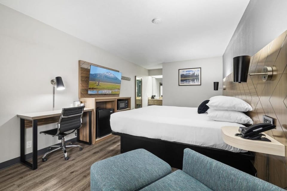Kick back after meetings with streaming-ready TV and workspace.