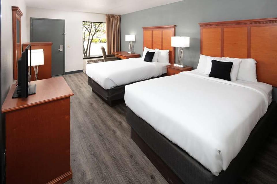 Stretch out on two plush beds after a full day.