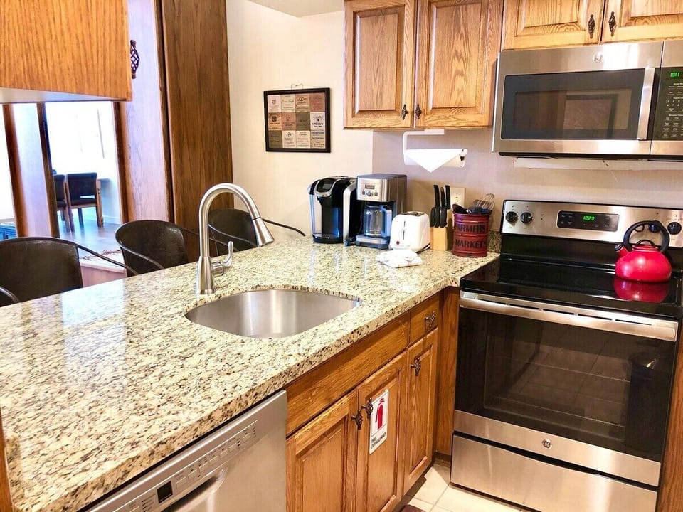 Wide granite countertops offer a comfy breakfast space. I hope you get to enjoy the gourmet kitchen.