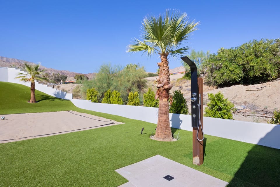 An outdoor shower great for rinsing off before dipping into one of the two pools!