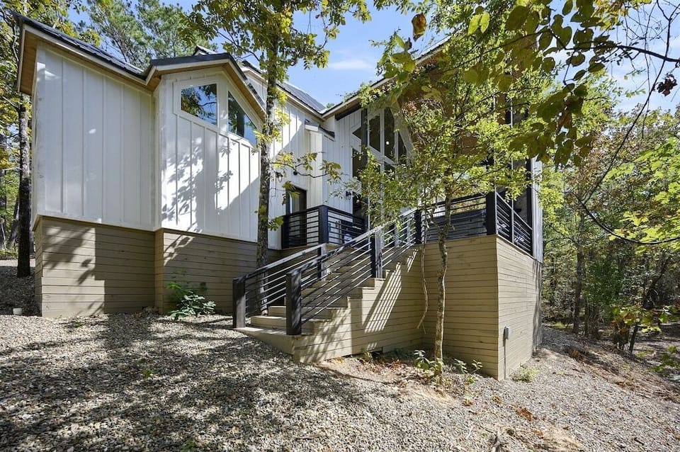 Exterior: Embrace nature in this modern retreat with stunning forest views and sleek architecture!