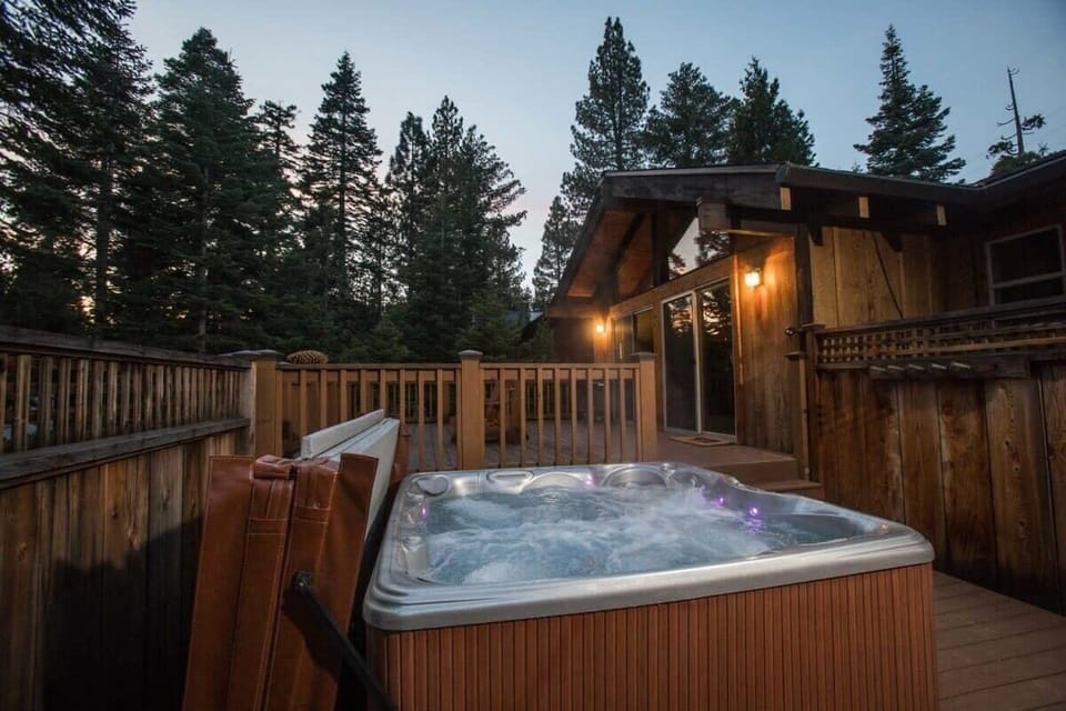 Soak away in the top-of-the-link hot tub while you take in the beautiful nature views surrounding the home.
