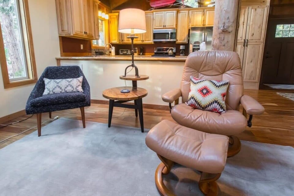 Read a book, or enjoy a cup of coffee by the fire in one of the two comfortable chairs situated in the living room.