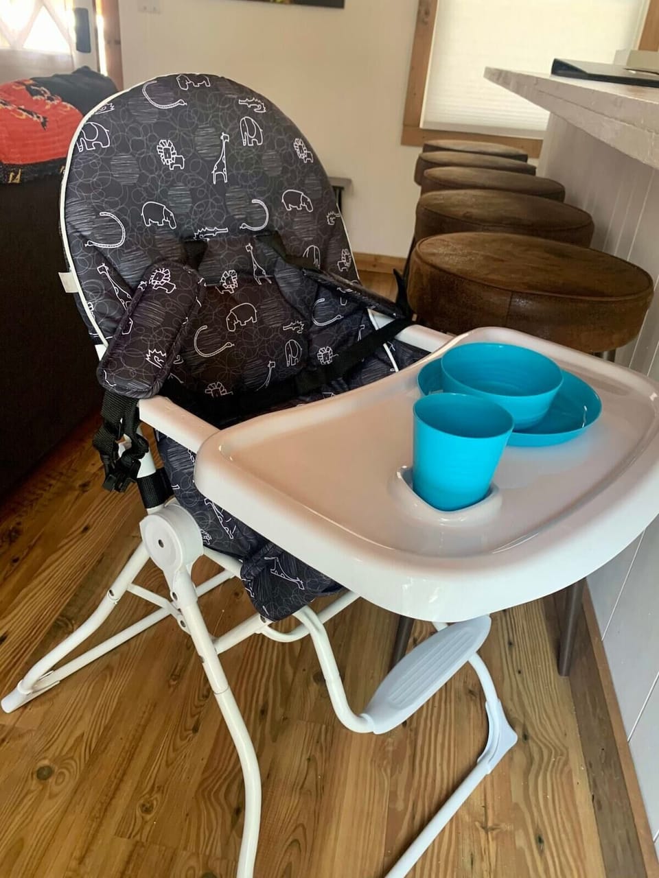 The family-friendly home features a high chair and children's plates for guest use.