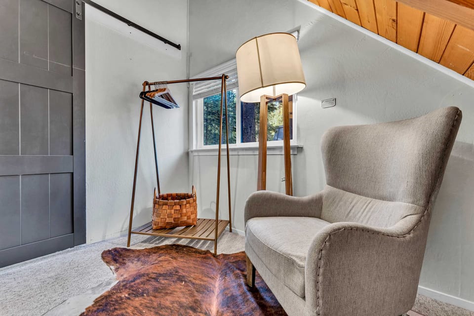 Bedroom 3: Queen bed, upper level, clothes rack