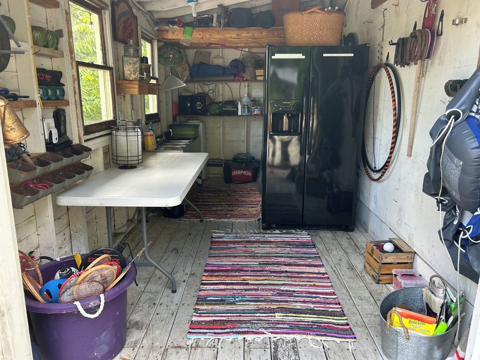The shed off the main deck has another full-sized refrigerator/freezer & games  