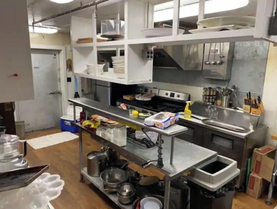 The kitchen has two gas ranges and two full-sized refrigerator/freezers