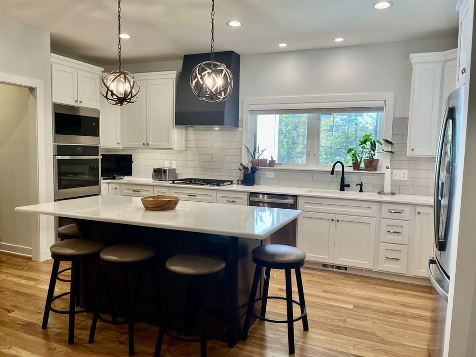 Double ovens, microwave, gas cooktop, dishwasher, large fridge. 