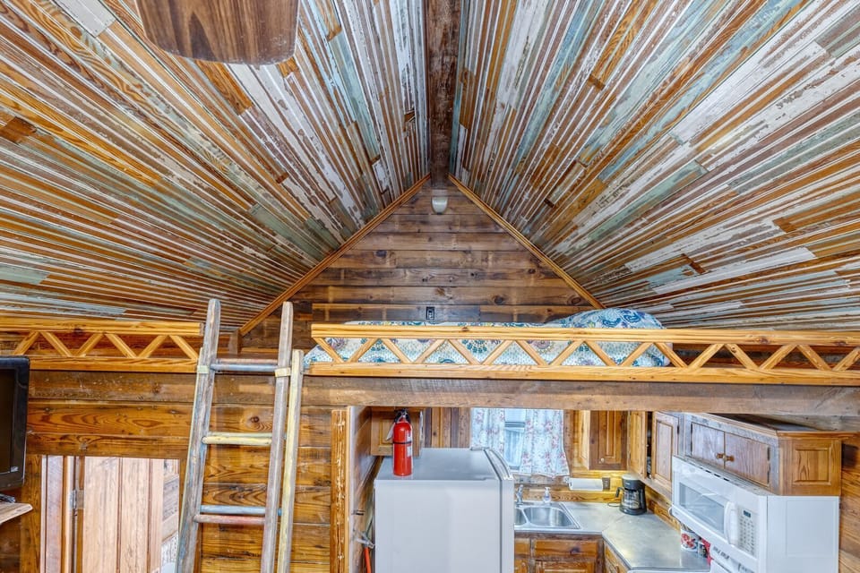 Loft area with a queen size mattress.