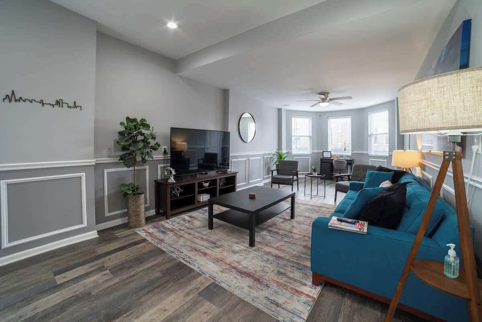 Living Room with a 60" Smart TV. Queen size memory foam sofa sleeper.