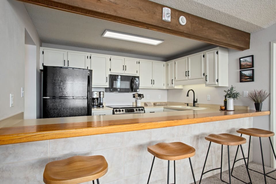 Grey Tiled Island Base with Wood Bar Top - Black Fridge / Freezer