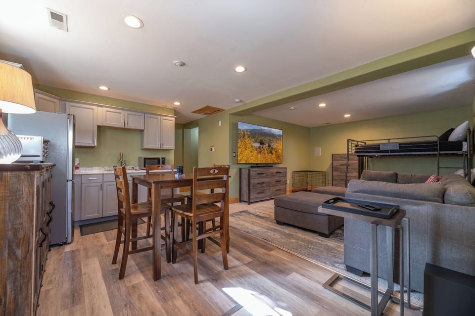 Downstairs Living Room with Large Screen TV, Bunk Beds and Kitchenette