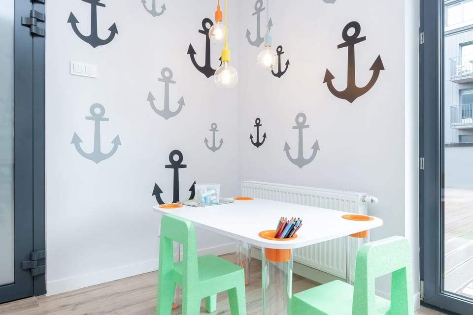 Kids’ corner with colorful nautical-themed decorations.
