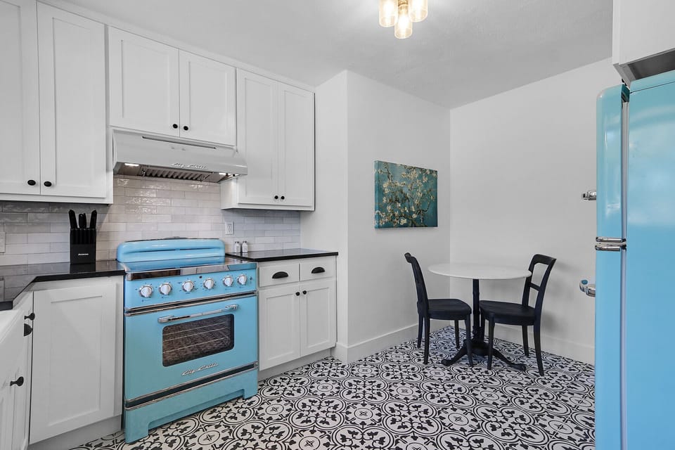 The dining room then leads into the full kitchen