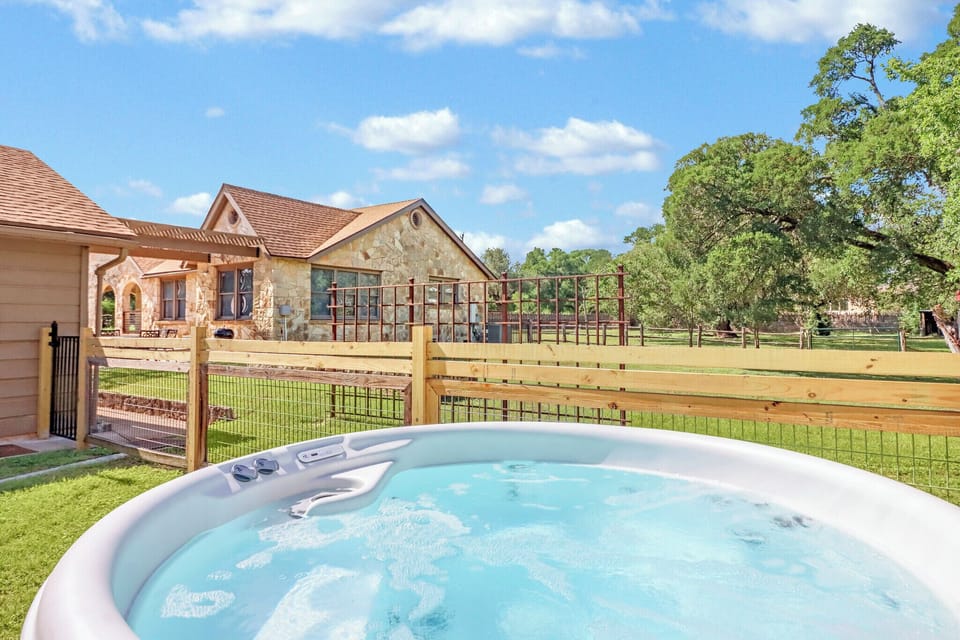 Enjoy the hot tub with a view of the backyard
