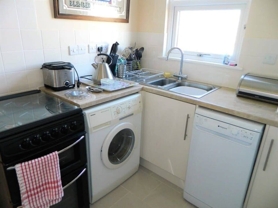 Kitchen ( please note washing machine not usable but launderette just over the road ) 