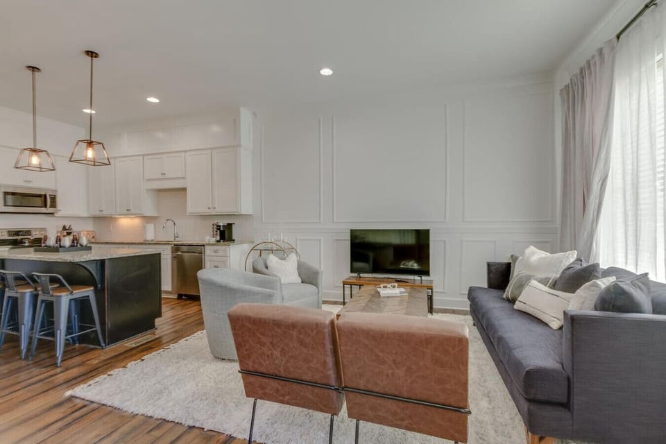 The open-concept kitchen and living room allow guests to mingle and enjoy the full main floor together.