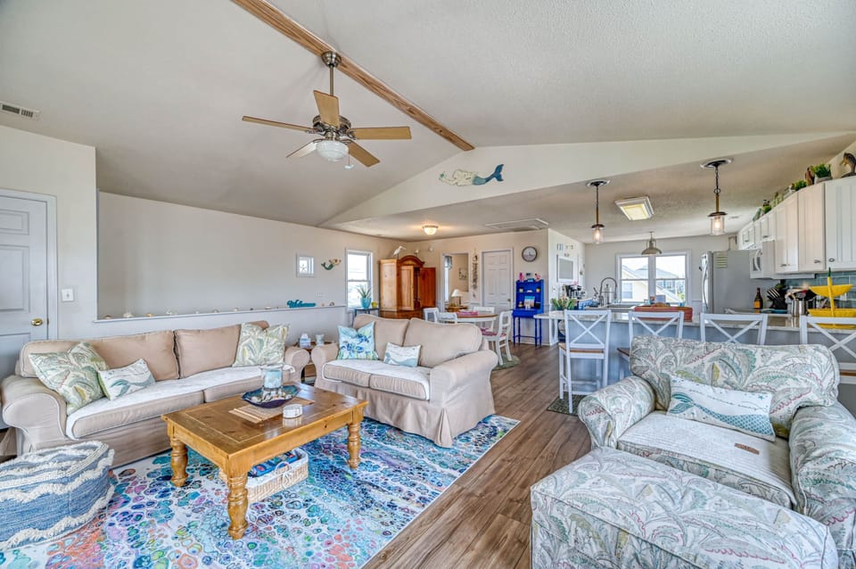 The living room, kitchen and dining room are an open floor plan on the top floor