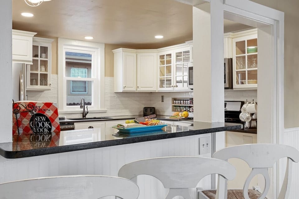 Kitchen with gas stove, new appliances and kitchen pantry items