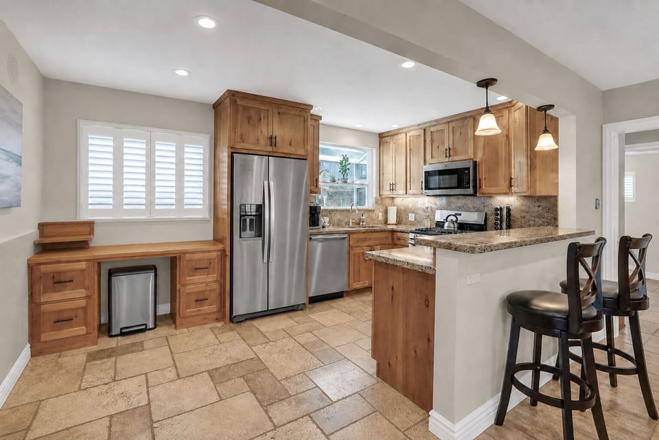 Everything you need to whip up a gourmet meal or a quick snack is right at your fingertips in this thoughtfully stocked kitchen.